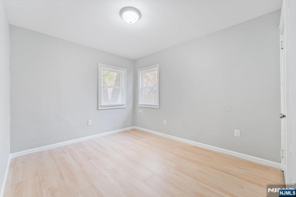 16 John Street, Unit 2 Lodi, NJ 07644 - Photo 12 of 32 an empty room with windows