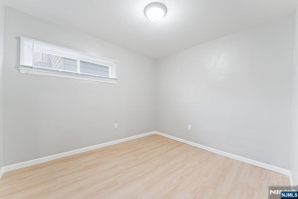 16 John Street, Unit 2 Lodi, NJ 07644 - Photo 15 of 32 a view of a room with wooden floor and windows