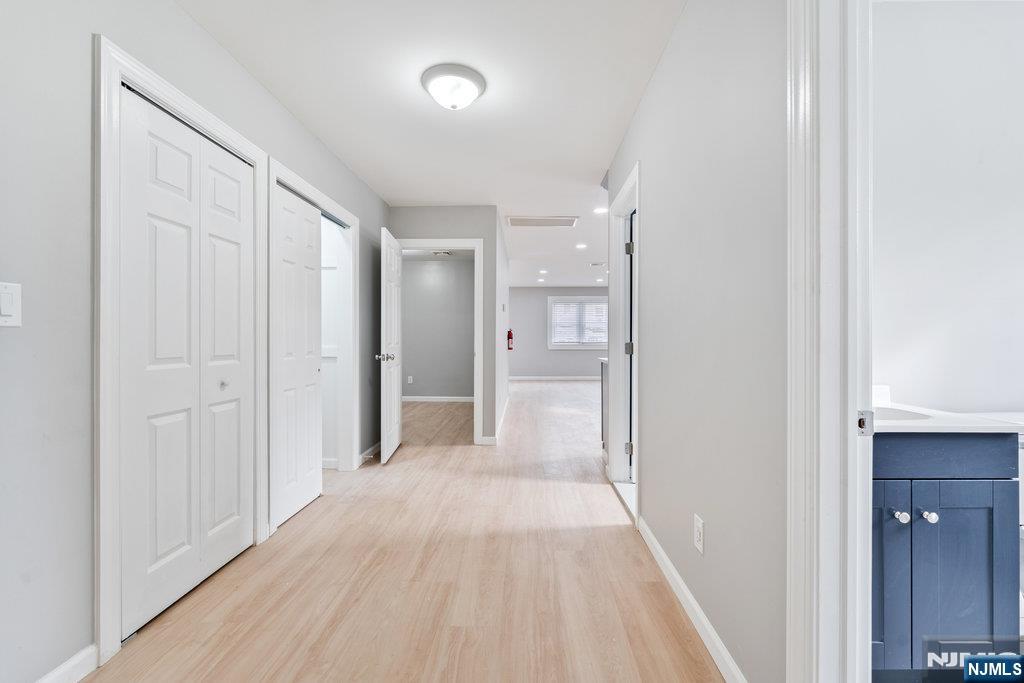 16 John Street, Unit 2 Lodi, NJ 07644 - Photo 19 of 32 a view of a hallway with wooden floor