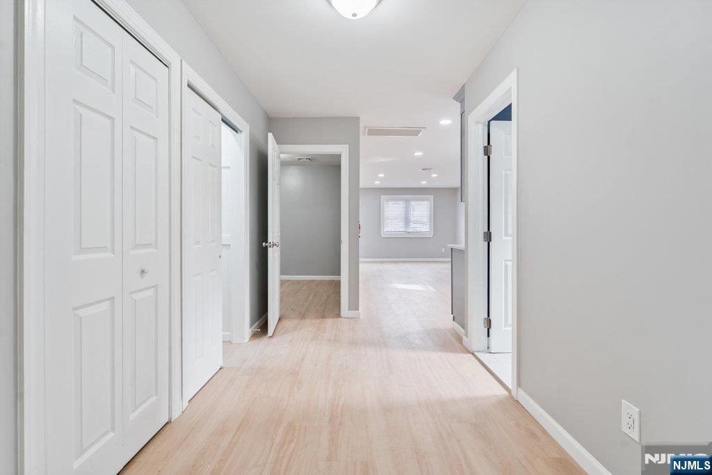 16 John Street, Unit 2 Lodi, NJ 07644 - Photo 20 of 32 a view of a hallway with wooden floor