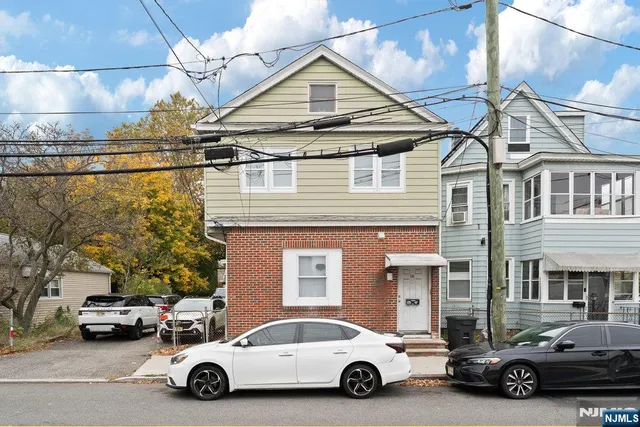 a car parked in front of a house