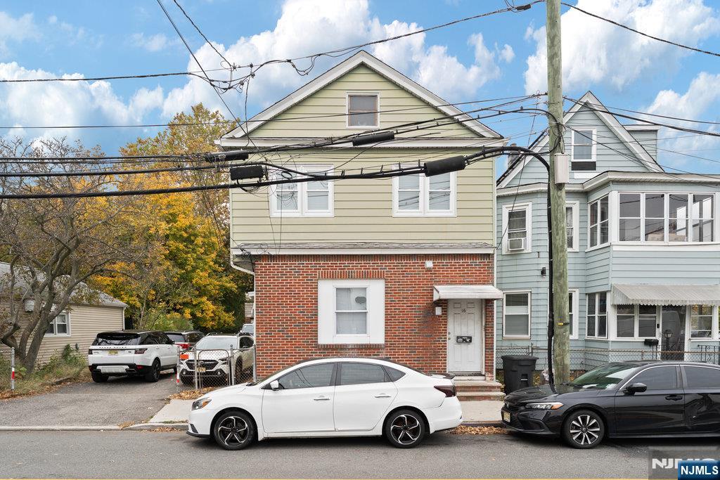 16 John Street, Unit 2 Lodi, NJ 07644 - Photo 2 of 32 a car parked in front of a house