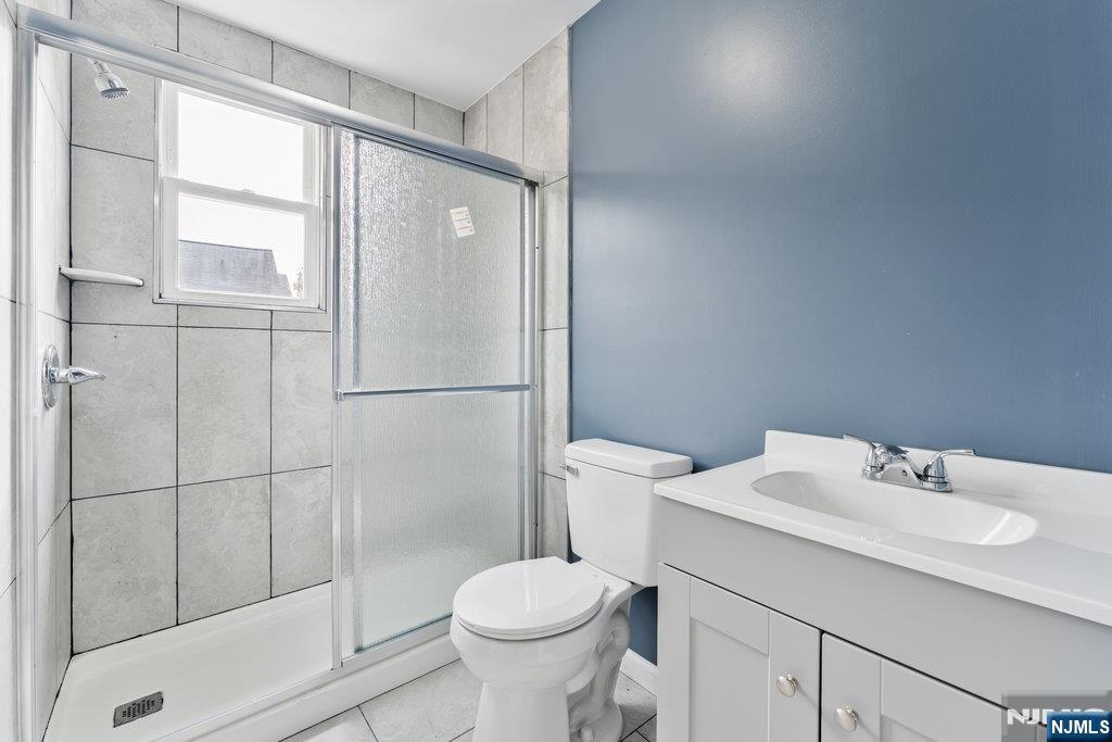 16 John Street, Unit 2 Lodi, NJ 07644 - Photo 22 of 32 a bathroom with a sink toilet and shower