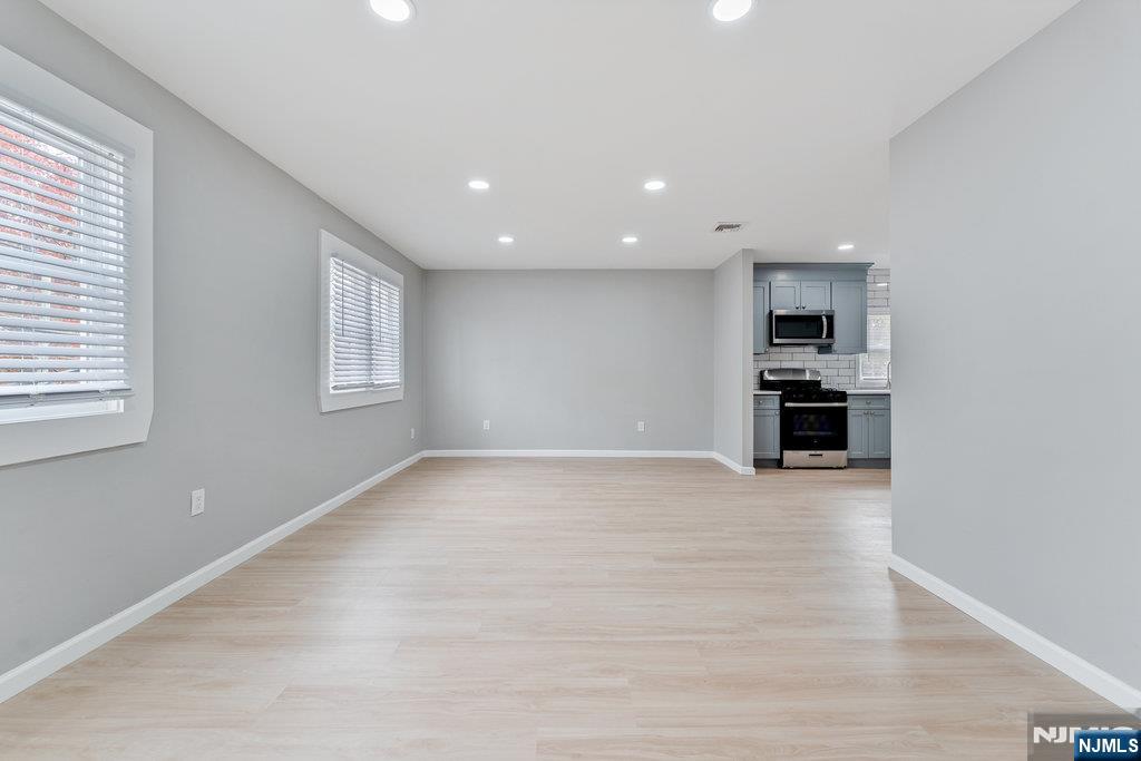 16 John Street, Unit 2 Lodi, NJ 07644 - Photo 30 of 32 a view of empty room with kitchen and window