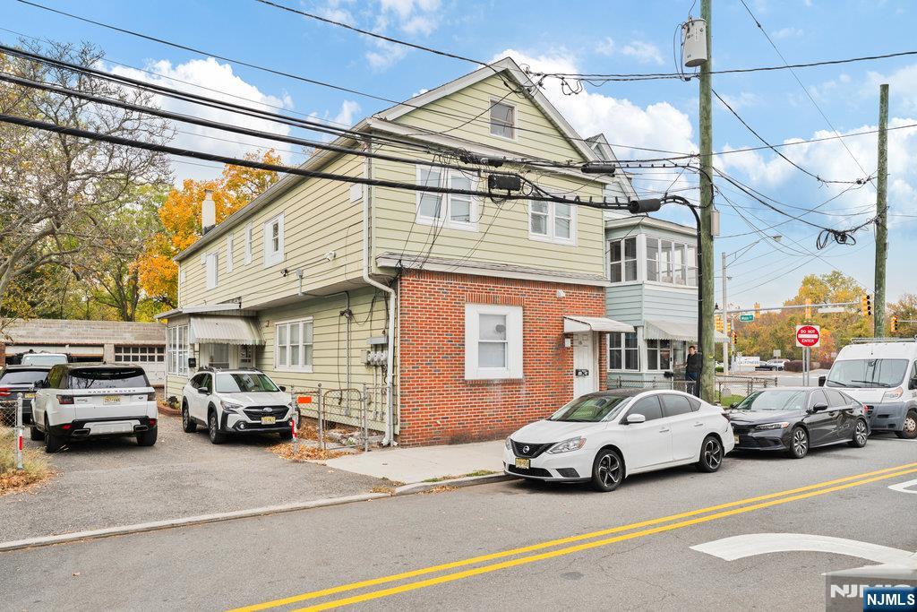 16 John Street, Unit 2 Lodi, NJ 07644 - Photo 3 of 32 a view of cars parked in front of a building