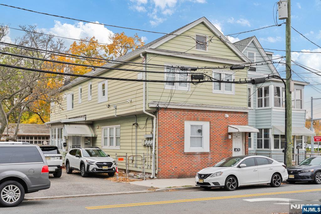 16 John Street, Unit 2 Lodi, NJ 07644 - Photo 4 of 32 a view of a cars park in front of a building
