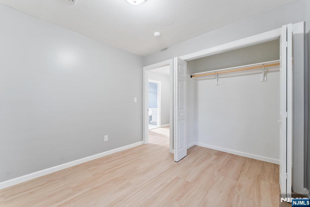 16 John Street, Unit 2 Lodi, NJ 07644 - Photo 6 of 32 a view of an empty room with wooden floor