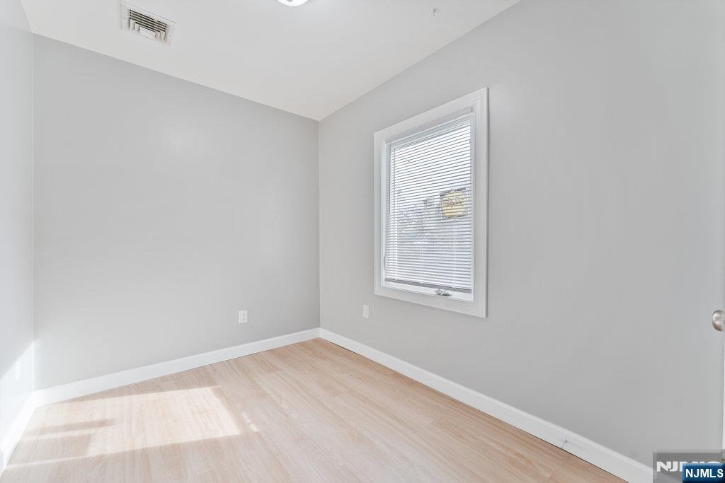 16 John Street, Unit 2 Lodi, NJ 07644 - Photo 7 of 32 an empty room with a window