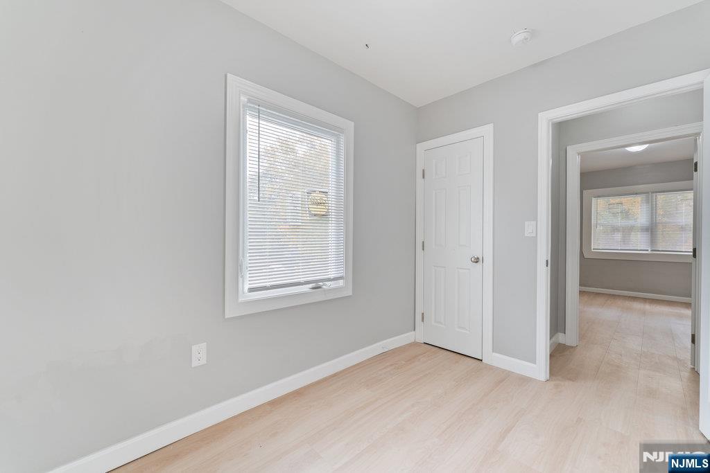 16 John Street, Unit 2 Lodi, NJ 07644 - Photo 8 of 32 an empty room with windows