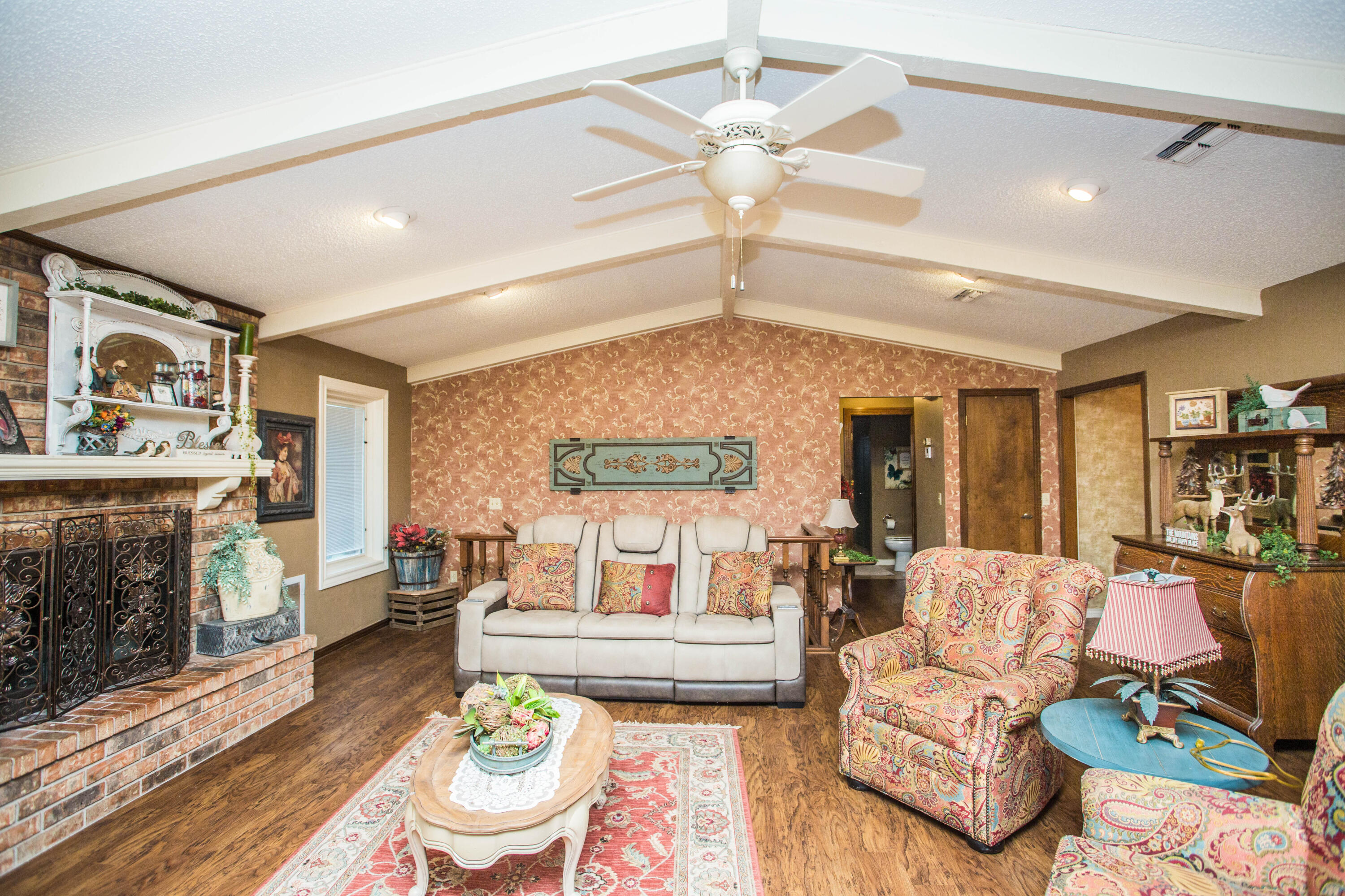1304 Jefferson Drive Plainview, TX 79072 - Photo 14 of 50 a living room with furniture and a fireplace