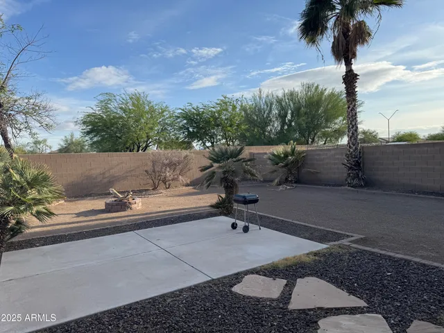 a picture of a yard with a table and chairs