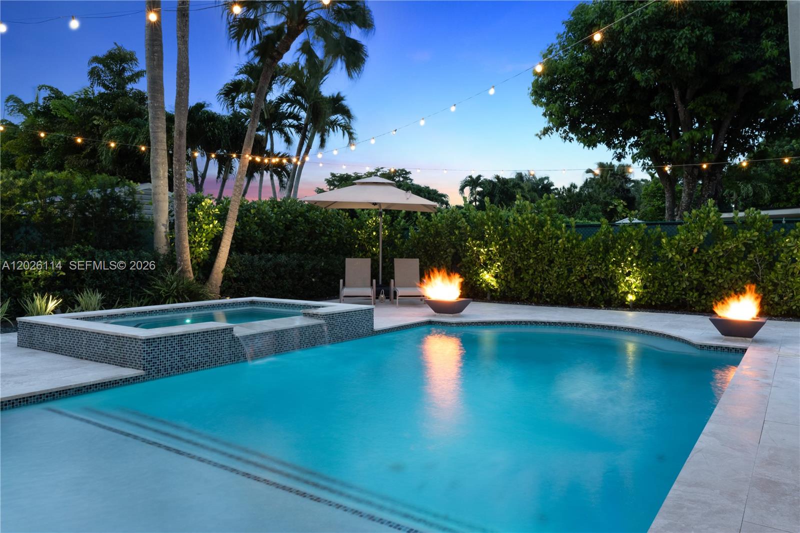 9641 Southwest 66th Street Miami, FL 33173 - Photo 41 of 57 a view of a swimming pool with a patio and a yard