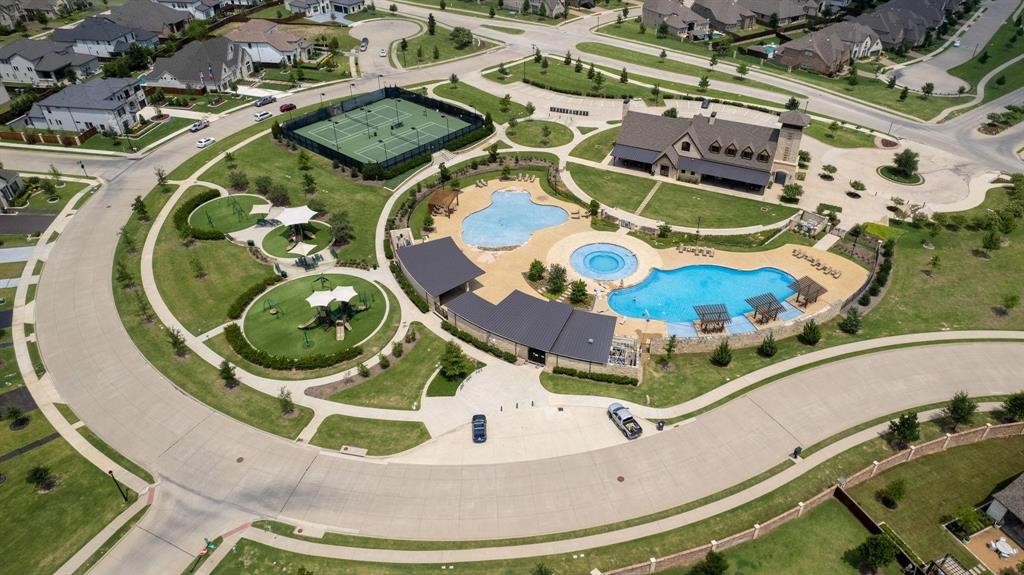 1650 Oakcrest Drive Prosper, TX 75078 - Photo 37 of 40 Aerial overview of property's location with a pool and nearby suburban area