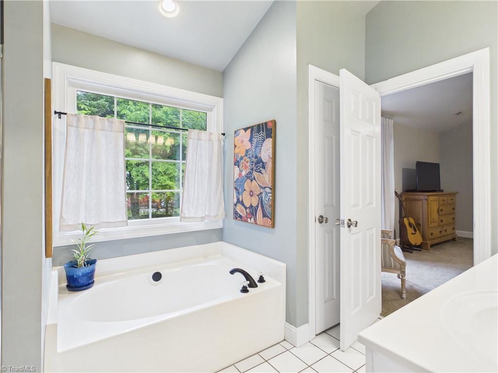 3105 Havasu Way High Point, NC 27265 - Photo 18 of 42 Huge spa like primary bathroom featuring a garden tub and separate shower.