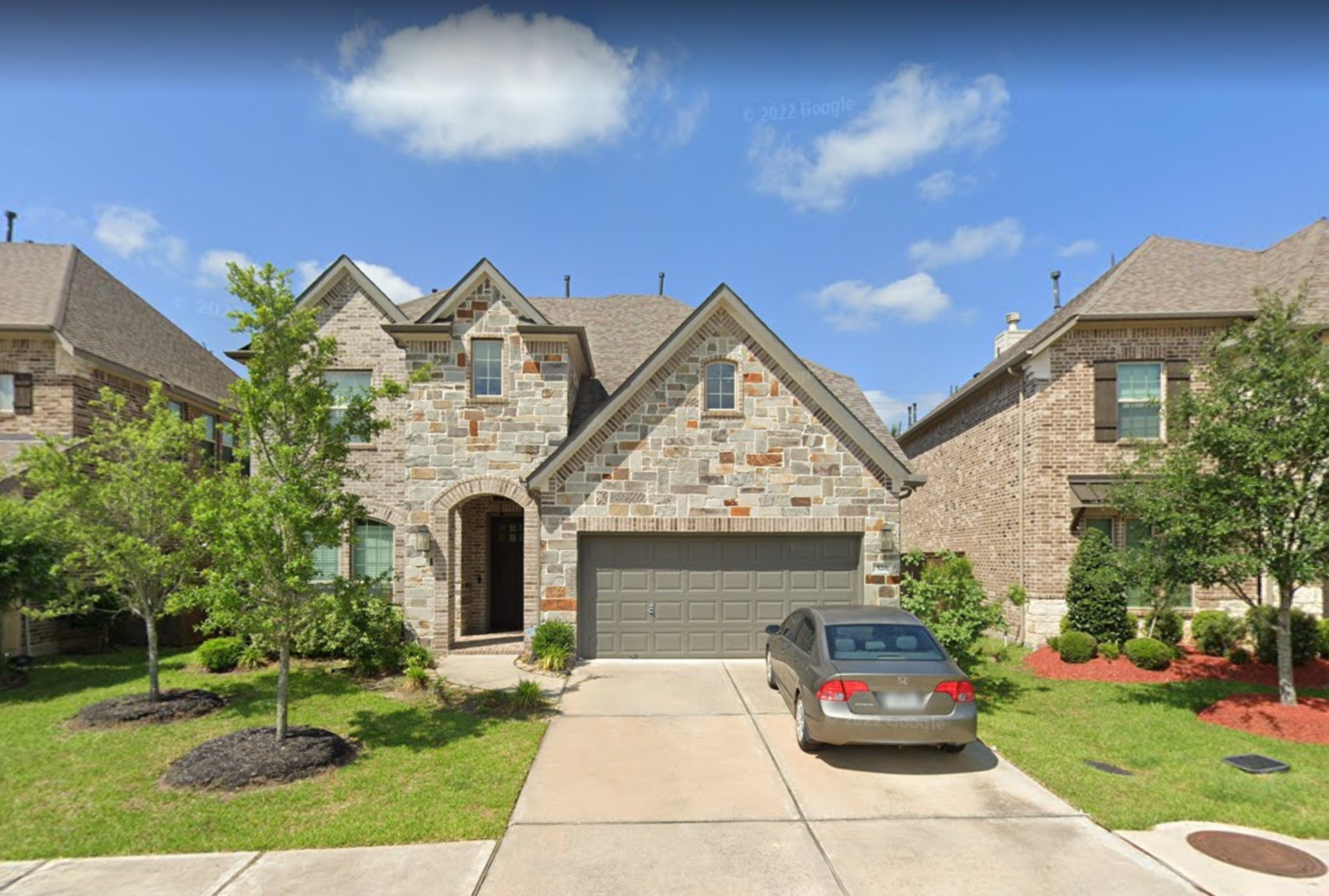 520 Pedernales Street Webster, TX 77598 - Photo 1 of 23 a front view of a house with garden