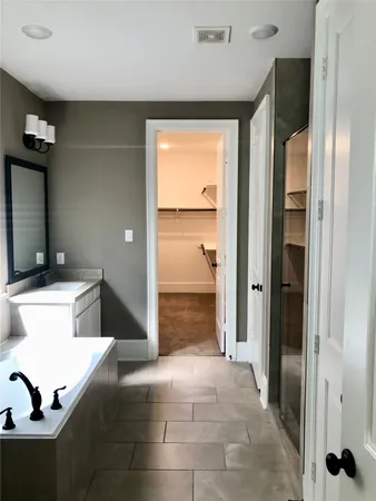 a view of a refrigerator in kitchen and living room