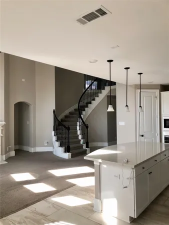 a very nice looking room with a ceiling fan