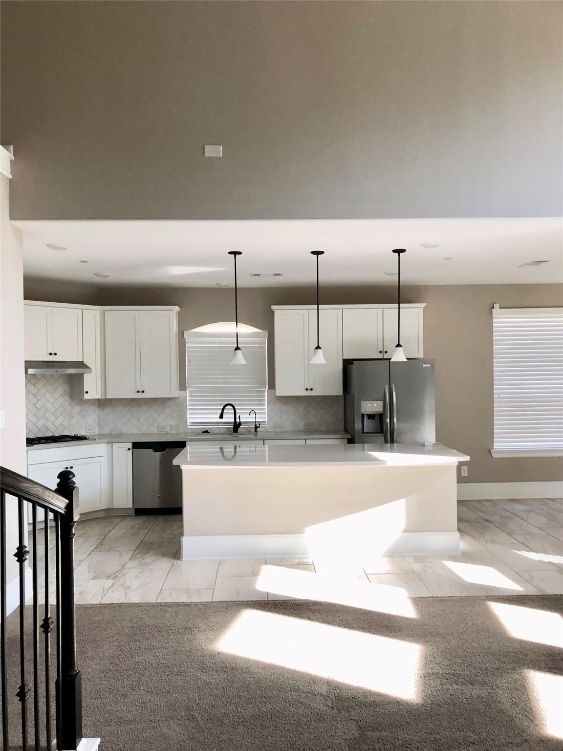 520 Pedernales Street Webster, TX 77598 - Photo 6 of 23 a large kitchen with stainless steel appliances kitchen island granite countertop a sink and cabinets