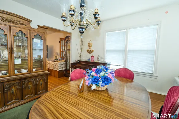 a bedroom with furniture and a large window