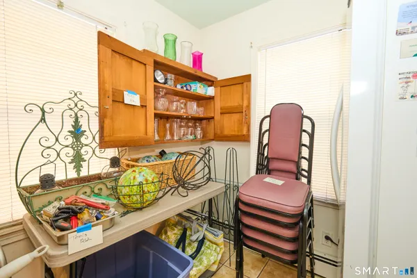 a room that has a bed and a table in it