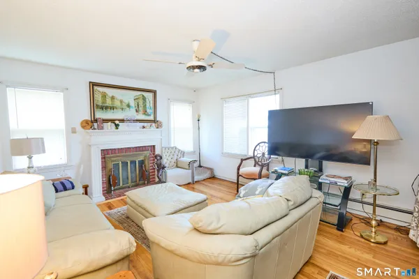 a living room with furniture and a fireplace