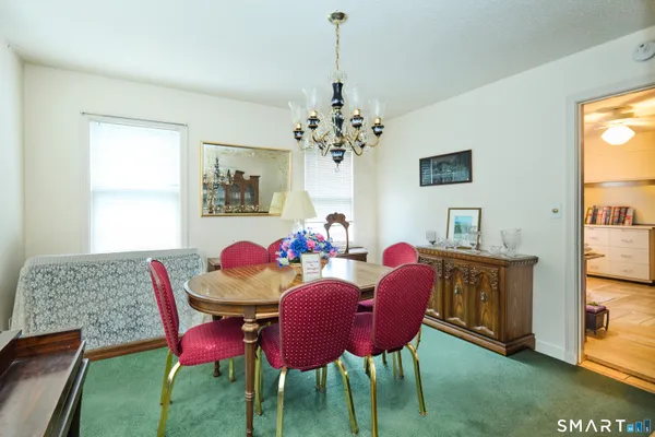 a dining room with furniture and window