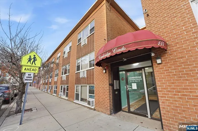 a view of a building with a umbrellas