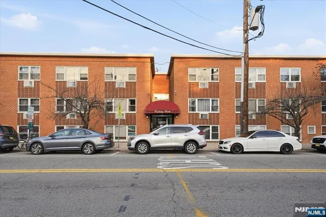 a view of parking with cars and parked cars