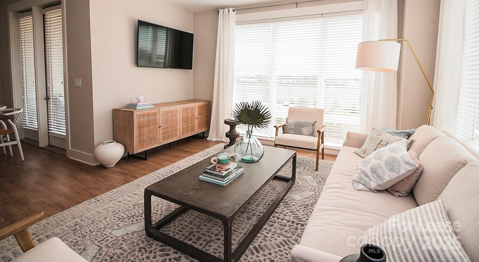 6408 Providence Farm Lane, Unit B2 Charlotte, NC 28277 - Photo 22 of 44 a living room with furniture and wooden floor