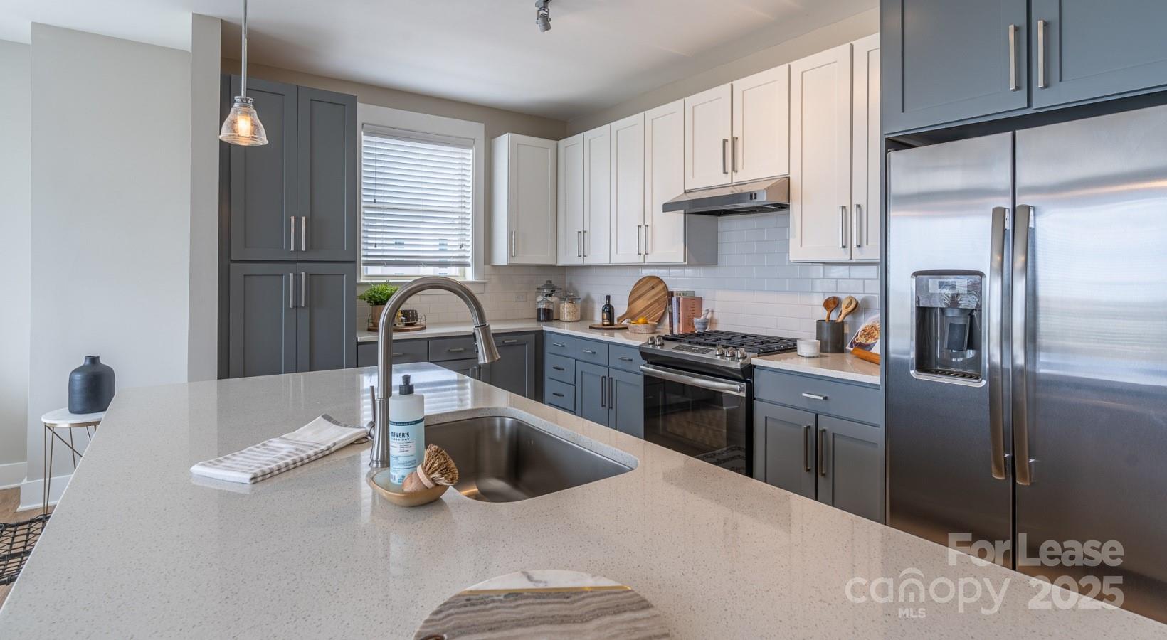 6408 Providence Farm Lane, Unit B2 Charlotte, NC 28277 - Photo 31 of 44 a kitchen with stainless steel appliances granite countertop a sink stove and refrigerator
