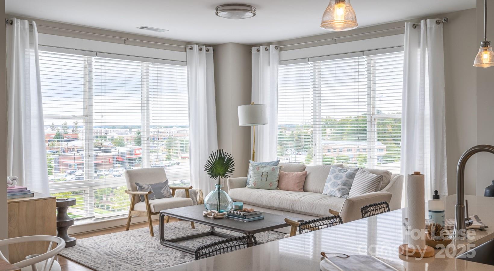 6408 Providence Farm Lane, Unit B2 Charlotte, NC 28277 - Photo 35 of 44 a living room with furniture and large windows