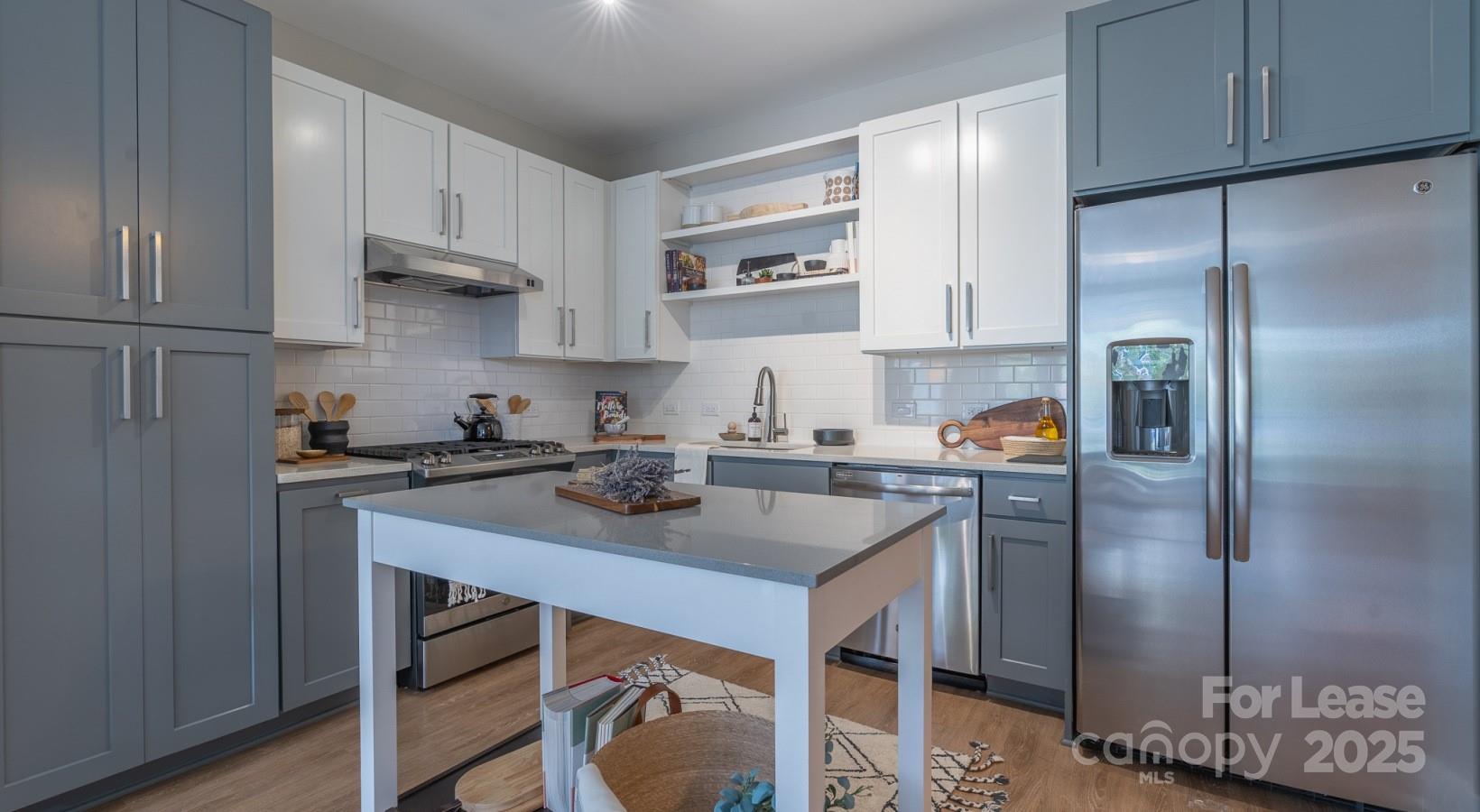 6408 Providence Farm Lane, Unit B2 Charlotte, NC 28277 - Photo 43 of 44 a kitchen with stainless steel appliances granite countertop a sink refrigerator and cabinets