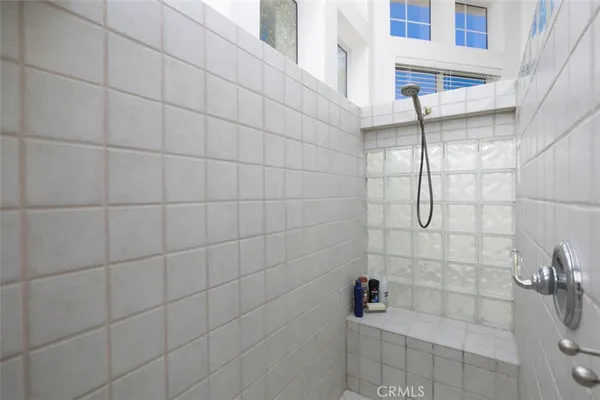 a bathroom with a double vanity sink mirror and toilet