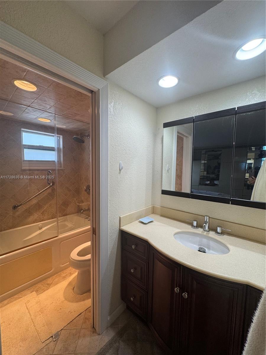 400 North Surf Road, Unit 701 Hollywood, FL 33019 - Photo 14 of 26 a bathroom with a sink double vanity and a mirror