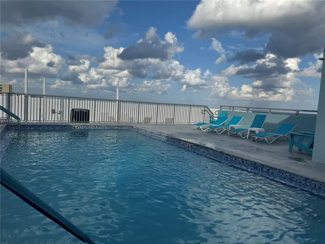 a view of balcony with wooden floor