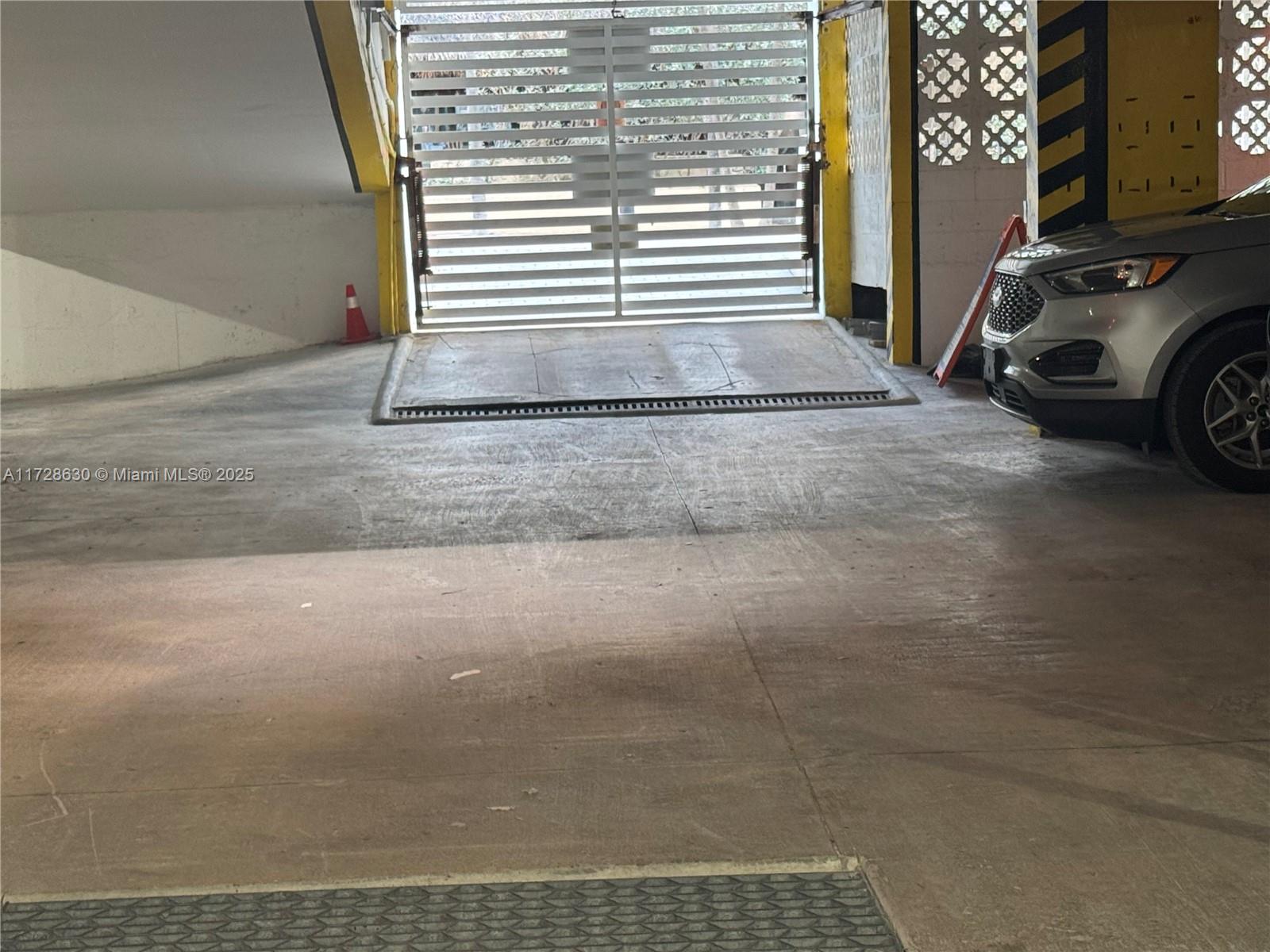 400 North Surf Road, Unit 701 Hollywood, FL 33019 - Photo 26 of 26 a view of garage with car parked