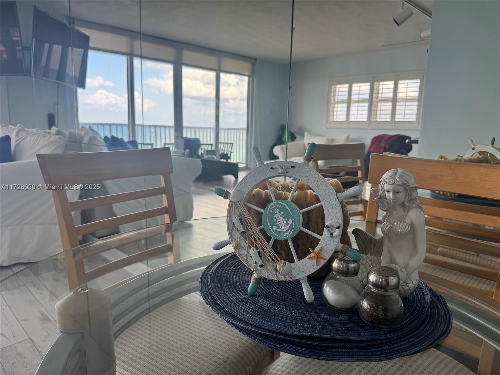 400 North Surf Road, Unit 701 Hollywood, FL 33019 - Photo 4 of 26 a room with furniture and a large window