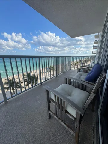 a view of balcony with furniture