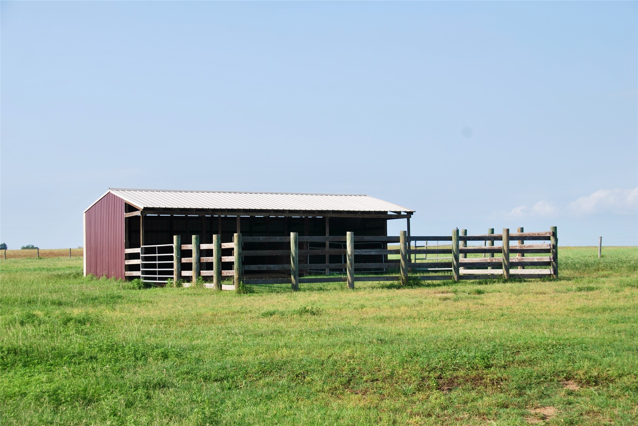 3545 East I- 10 Frontage Road Schulenburg, TX 78956 - Photo 36 of 40 a backyard of a house with lots of green space and bench
