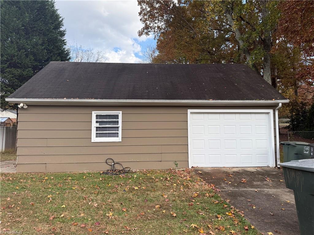 100 Kirk Road Greensboro, NC 27455 - Photo 13 of 42 New garage door to 600 sq ft wired 110 &220 garage & work space (stick built)
