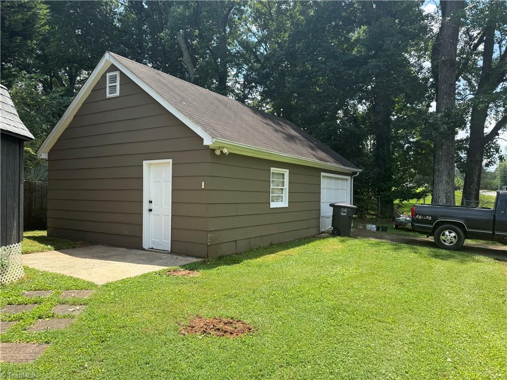 100 Kirk Road Greensboro, NC 27455 - Photo 30 of 42 600 square ft wired stick built detached garage with new garage door with driveway off Lawndale( has new garage door)
