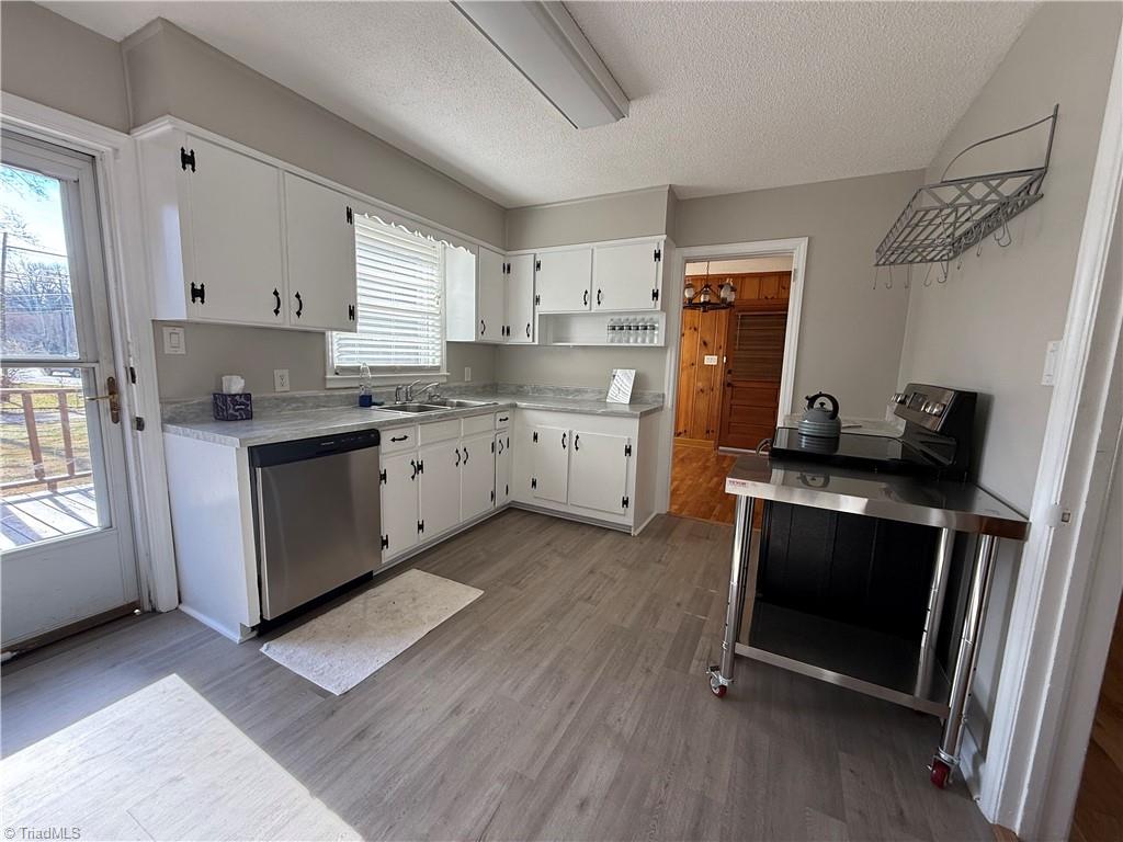 100 Kirk Road Greensboro, NC 27455 - Photo 33 of 42 Kitchen with new flooring,countertops,dishwasher,paint