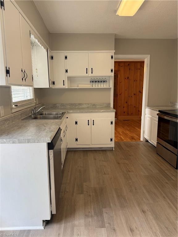 100 Kirk Road Greensboro, NC 27455 - Photo 8 of 42 Kitchen opens to dining area & gr eatroom