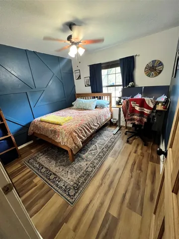 a bedroom with bed and window