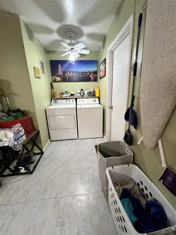 a kitchen with a refrigerator and a stove