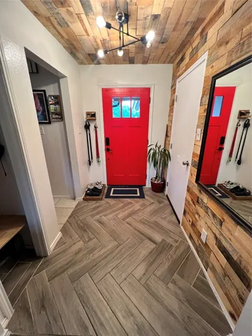 a view of an entryway with wooden floor