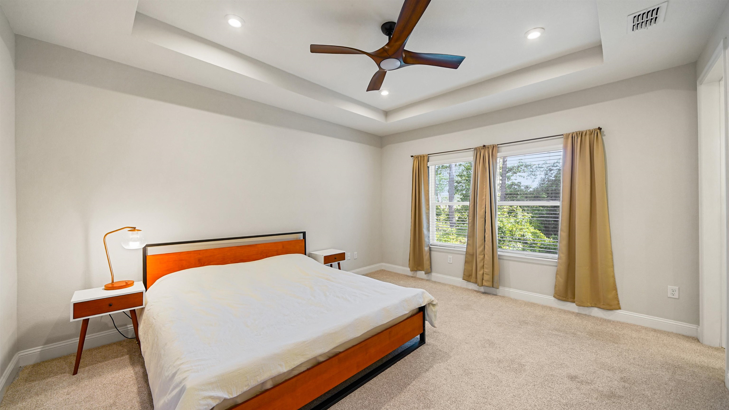 14141 Backbarrier Road Jacksonville, FL 32224 - Photo 15 of 45 a blue bed sitting in a room next to a window