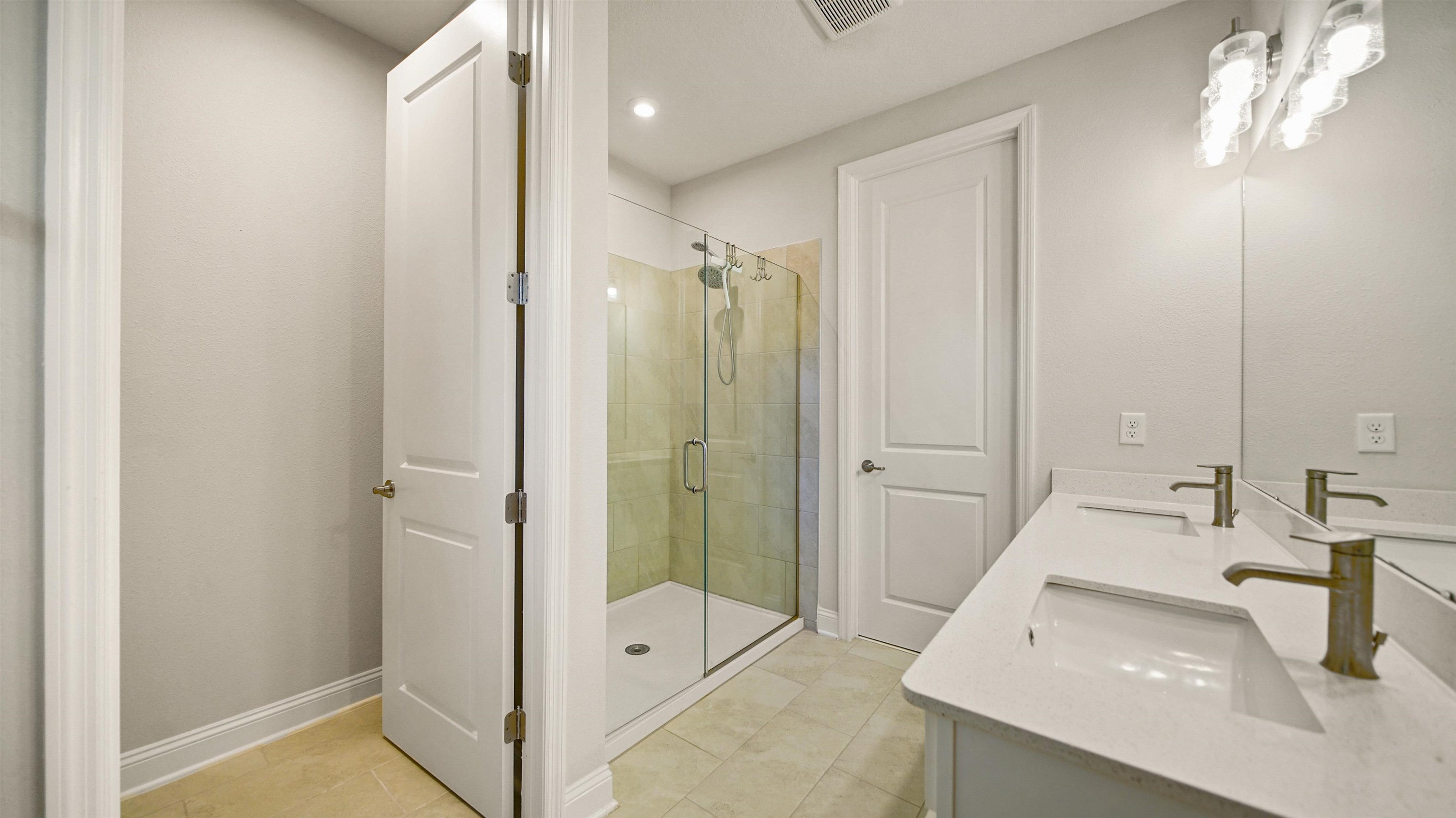 14141 Backbarrier Road Jacksonville, FL 32224 - Photo 17 of 45 a bathroom with a sink and a mirror
