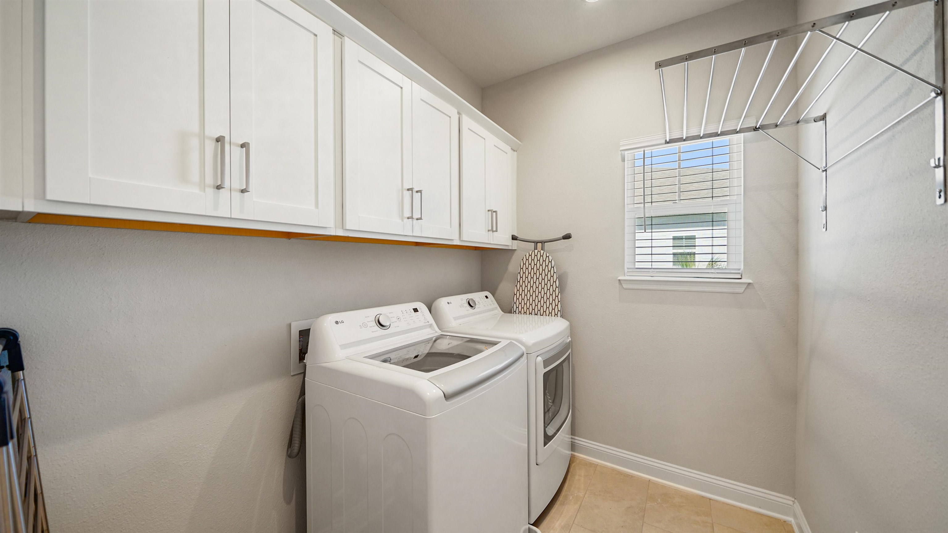 14141 Backbarrier Road Jacksonville, FL 32224 - Photo 24 of 45 a utility room with dryer and washer