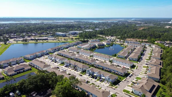 an aerial view of a city with lake view